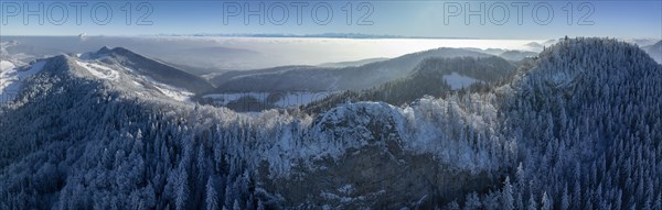 View over the first Jura chain with Belchenflueh in winter into the Central Plateau with high fog, behind it Alpine panorama, drone shot, Haegendorf, Solothurn, Switzerland, Europe
