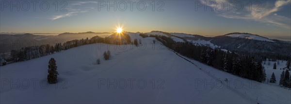 Sunset over the second Jura chain in winter, foreground contours of sinkholes, view towards the first Jura chain with Weissenstein, drone image, Brunnersberg, Solothurn, Switzerland, Europe