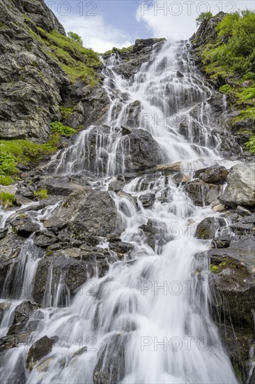 Waterfall on a mountainside, long exposure, Berliner Hoehenweg, Zillertal Alps, Tyrol, Austria, Europe