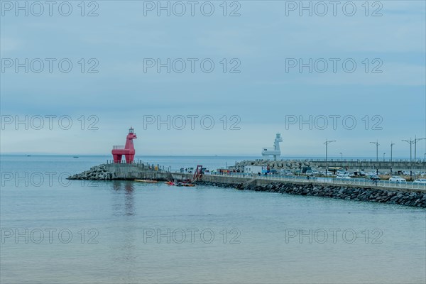 Lighthouses built to look like horses on concrete prier in Jeju, South Korea, Asia