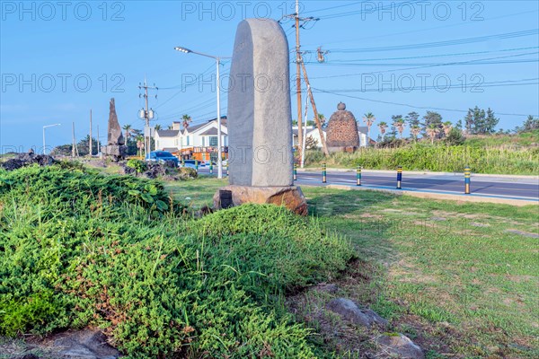 Large stone monuments at public park under blue sky in Jeju, South Korea, Asia