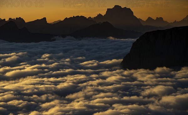 Sunrise over a sea of fog and Dolomite peaks in the background, Corvara, Dolomites, Italy, Europe