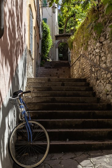 Alley with stairs and bicycle, old town centre of Malcesine, Lake Garda, Province of Verona, Italy, Europe