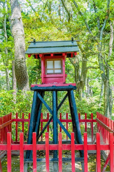 Small wooden replica of Shinto shrine in Japanese garden park in Hiroshima, Japan, Asia