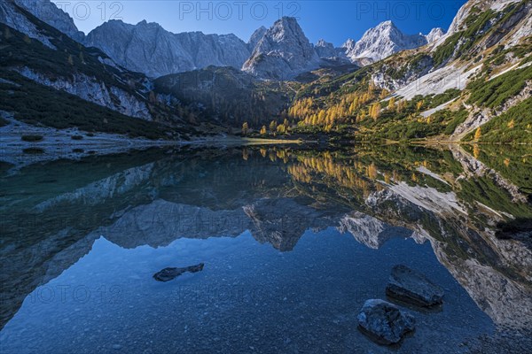 Mountains reflected in mountain lake, sun, autumn, Seebensee, Mieminger Kette, Tyrol, Austria, Europe