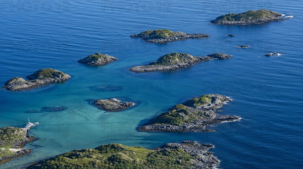 Coast and rocky islands in the blue sea, sea with archipelago islands, Ulvagsundet, Vesteralen, Norway, Europe