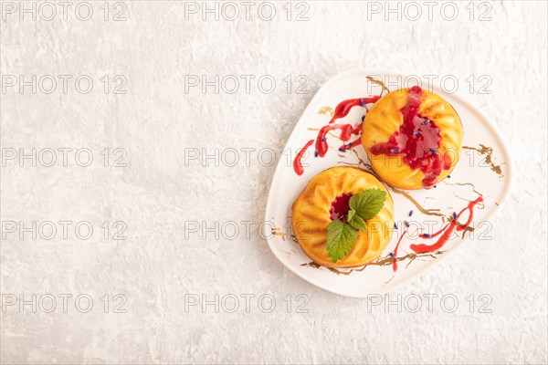 Semolina cheesecake with strawberry jam, lavender on gray concrete background. top view, flat lay, copy space