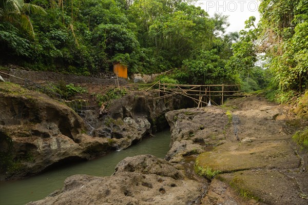 Uma Anyar waterfall, Bali island, Ubud, Indonesia. Jungle, tropical forest, daytime with cloudy sky