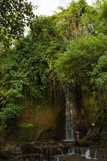 Uma Anyar waterfall, Bali island, Ubud, Indonesia. Jungle, tropical forest, daytime with cloudy sky