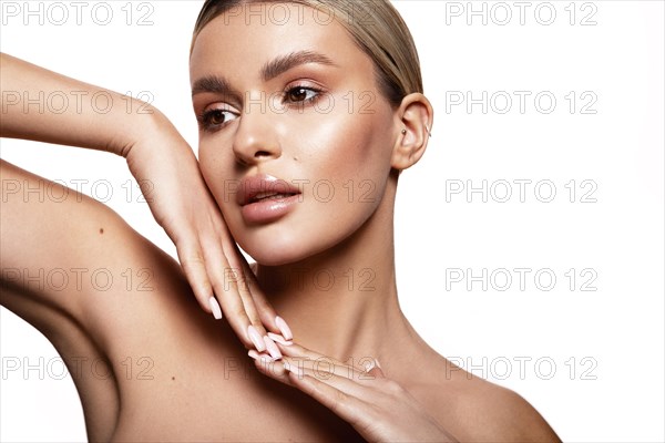 Beauty portrait of model with natural make-up. Fashion shiny highlighter on skin, sexy gloss lips make-up High quality photo