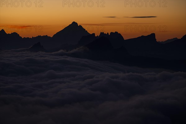 Sunrise over a sea of fog and Dolomite peaks in the background, Corvara, Dolomites, Italy, Europe