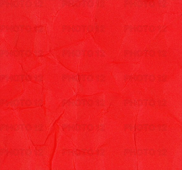 Crumpled red paper texture background