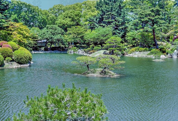 Small island in middle of lake in Shukkeien Gardens in Hiroshima, Japan, Asia