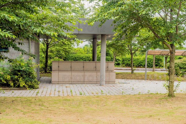 Covered marble water basin with five faucets in rural park in Jeju, South Korea, Asia