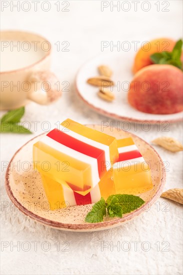 Almond milk and peach jelly on gray concrete background. side view, close up, selective focus