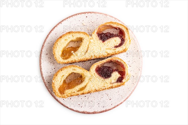 Homemade sweet bun with apricot jam isolated on white background. top view, flat lay