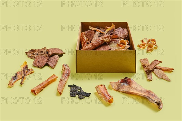 Craft cardboard box with assortment of dehydrated treats for dogs