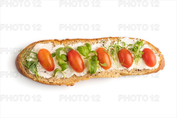 Long white bread sandwich with cream cheese, tomatoes and microgreen isolated on white background. top view, flat lay, close up
