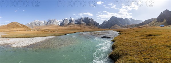 Mountain landscape with yellow meadows and river Kol Suu, mountain peak with glacier, hike to the mountain lake Kol Suu, Keltan Mountains, Sary Beles Mountains, Tien Shan, Naryn Province, Kyrgyzstan, Asia