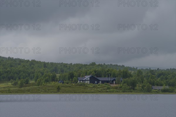 Cabin at Lake Aenevatnet in the rain, landscape format, inland waters, log cabin, holiday home, fjell, fjell cabin, plateau, wooden house, landscape, landscape photo, panoramic photo, summer, shore, clouds, secluded, remote, lonely, Uvdal, Viken, Norway, Europe