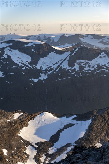 Mountain peak with Jostedalsbreen glacier in the evening light, view from the summit of Skala, Loen, Norway, Europe