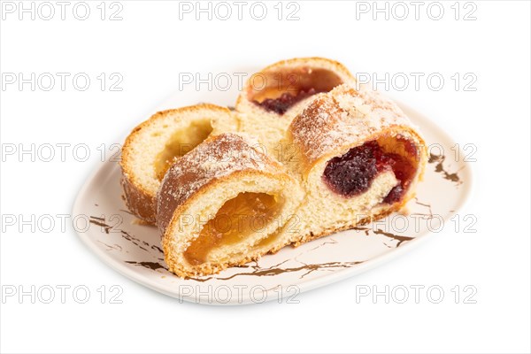 Homemade sweet bun with apricot jam isolated on white background. side view, close up