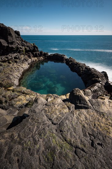 Long exposure natural pool Brimketill, near Grindavik, Reykjanes Peninsula, Iceland, Europe