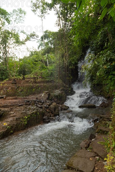 Uma Anyar waterfall, Bali island, Ubud, Indonesia. Jungle, tropical forest, daytime with cloudy sky