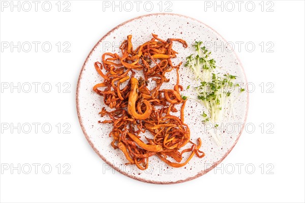 Fried Cordyceps militaris mushrooms isolated on white background with microgreen, herbs and spices. Top view, flat lay, close up