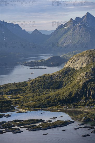 Fjord Raftsund and mountains in atmospheric evening light, view from the summit of Dronningsvarden or Stortinden, Vesteralen, Norway, Europe