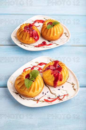 Semolina cheesecake with strawberry jam, lavender, on blue wooden background. side view, close up