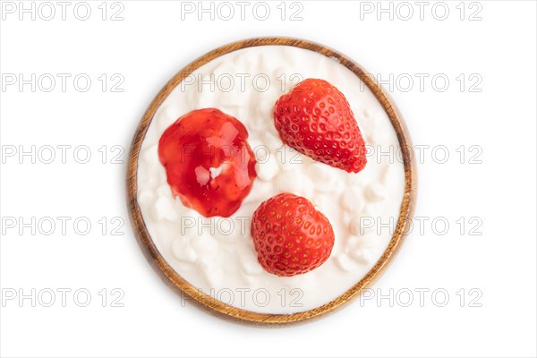 Grained cottage cheese with strawberry jam isolated on white background. top view, flat lay