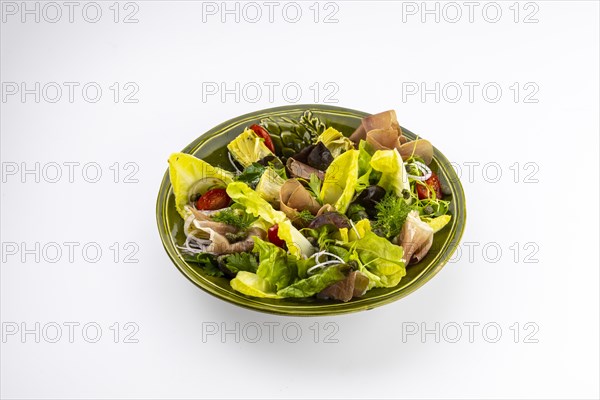 Food photography Various salads with artichokes and Serrano ham