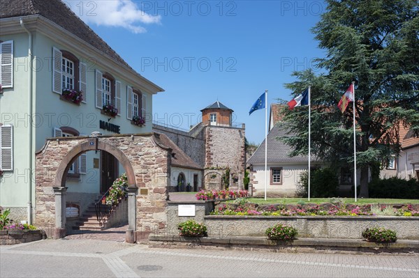 Town hall with historic municipal wine press and former town wall, Westhoffen, Alsace, France, Europe