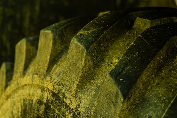 Closeup of tire tread of industrial heavy equipment roadwork machine