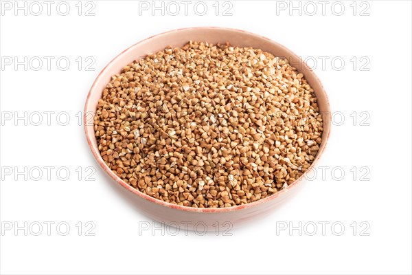 Raw buckwheat isolated on white background. Side view, close up