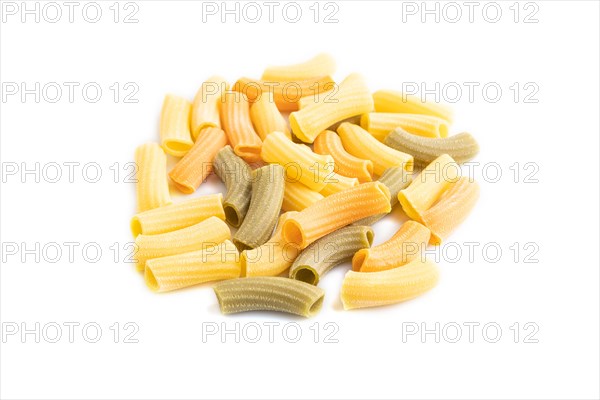 Rigatoni colored raw pasta isolated on white background. Side view