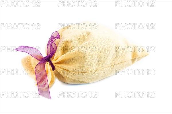 Yellow textile pouch isolated on white background. Side view, close up