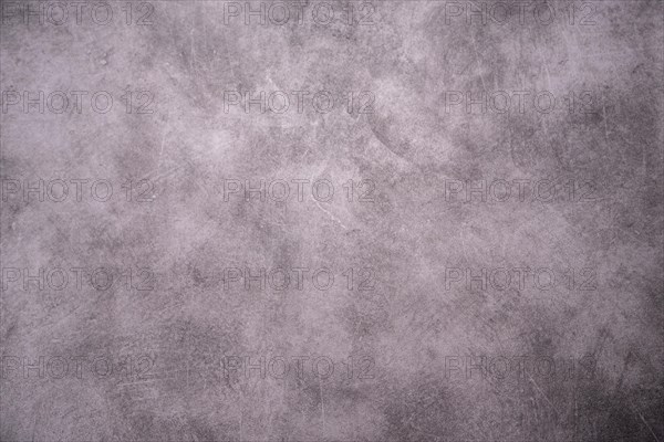 A simple grey concrete surface with an abstract texture