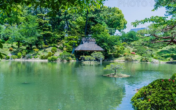 Landscape of lake and shelter at Shukkeien Gardens in Hiroshima, Japan, Asia