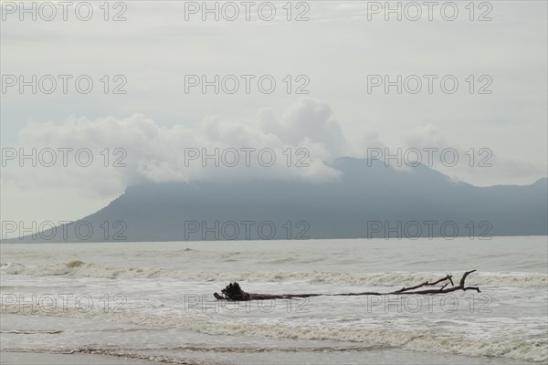 Bako national park, sea sandy beach, waves, overcast, cloudy day, sky and sea. Vacation, travel, tropics concept, no people, Malaysia, Kuching, Asia