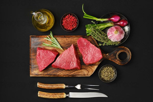 Top view of tri tip beef loin steak with spice and herbs