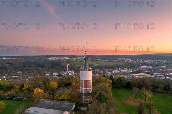 Tower in the foreground with a view of the landscape at sunset and a pink sky, Pforzheim, Germany, Europe