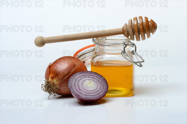 Honey in a jar and onions, ingredients for cough syrup