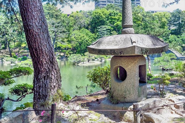 Large stone lantern in Shukkeien gardens in Hiroshima, Japan, Asia