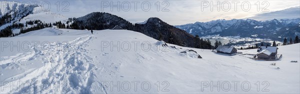 Winter mood, snow-covered landscape, snow-covered alpine peaks, view from the Schafbergalm to Lake Wolfgangsee, panoramic shot, near St. Wolfgang am Wolfgangsee, Salzkammergut, Upper Austria, Austria, Europe