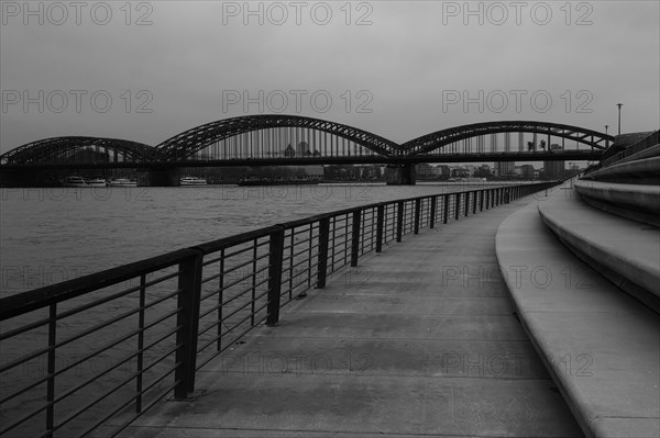 View over the Rhine promenade with bridge behind, black and white, Cologne, Germany, Europe