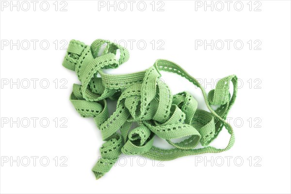 Green braid isolated on white background. Top view, flat lay, close up