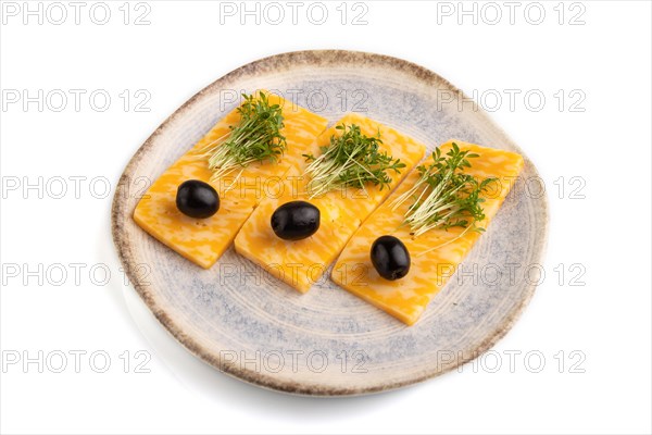 Marble cheese with olives and watercress microgreen isolated on white background. side view, close up