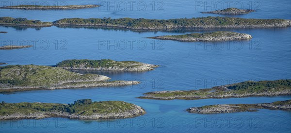 Rocky islands in the blue sea, sea with archipelago islands, Ulvagsundet, Vesteralen, Norway, Europe